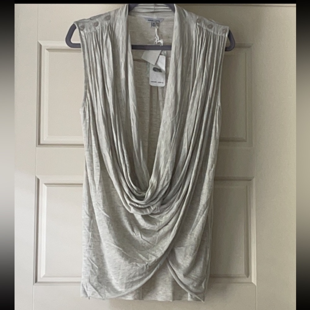 This is an ivory drape top that goes over a cami.